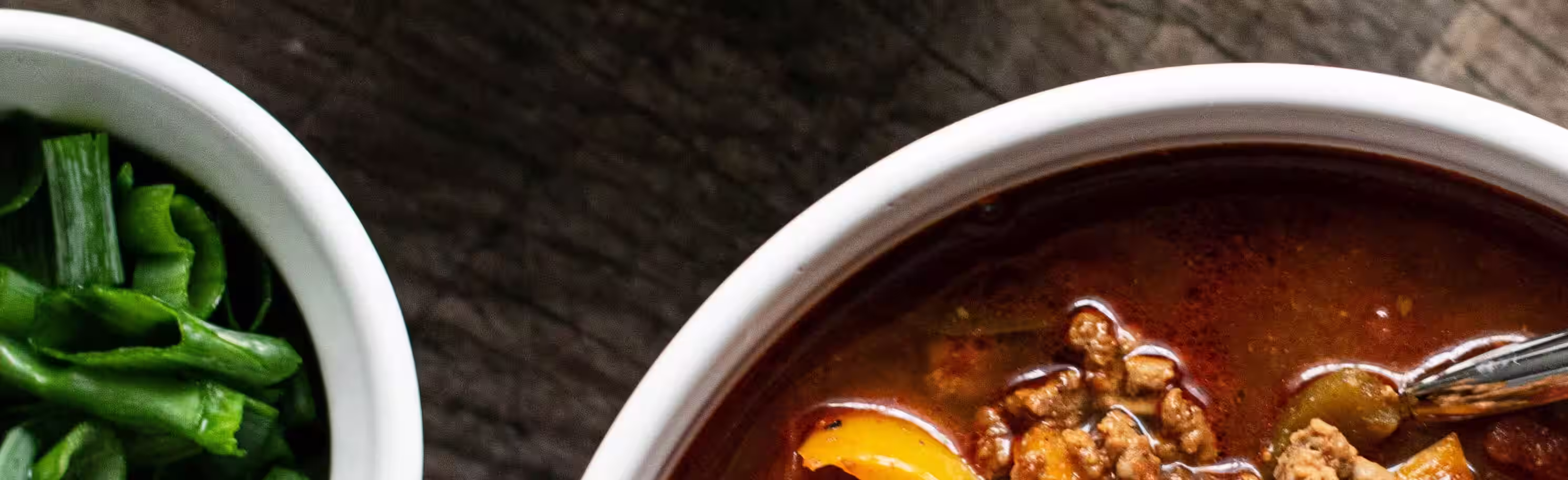 A detailed close up view of a fresh bowl of warm soup.