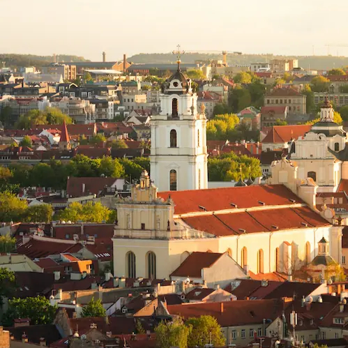 An overview of an orange and white coloured city with a sunset where soup festivals are held and celebrated with fresh and traditional recipes.